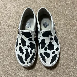 Vans Classic Slip-On Cow Print Canvas Flats in White and Black